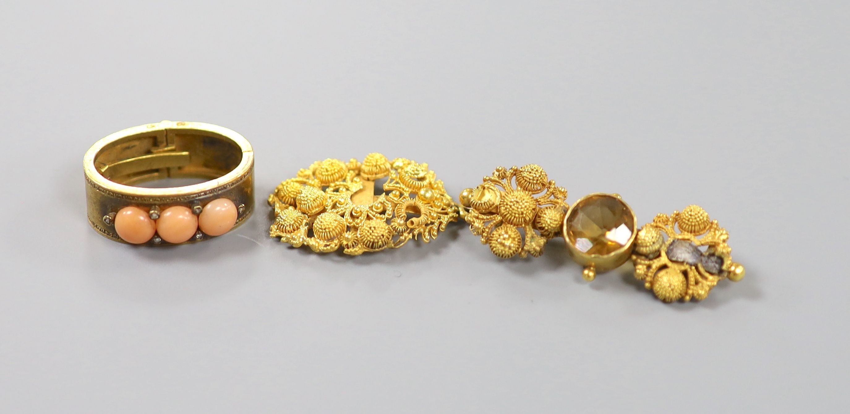 An Edwardian yellow metal, coral and diamond chip set scarf clip, 22mm and two yellow metal filigree items, gross 14.4 grams.